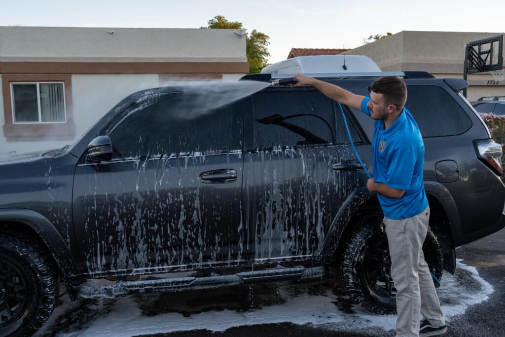 Auto Detailing Pricing Scottsdale AZ – mobile detailer washing SUV exterior